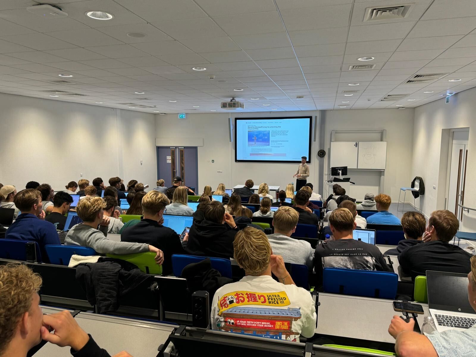 Wesley speaking to a full lecture hall at Hogeschool van Amsterdam